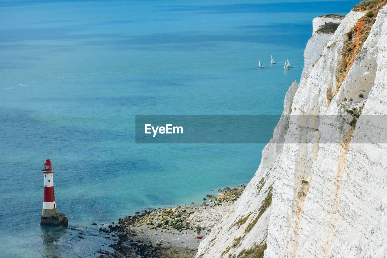 High angle view of lighthouse by sea