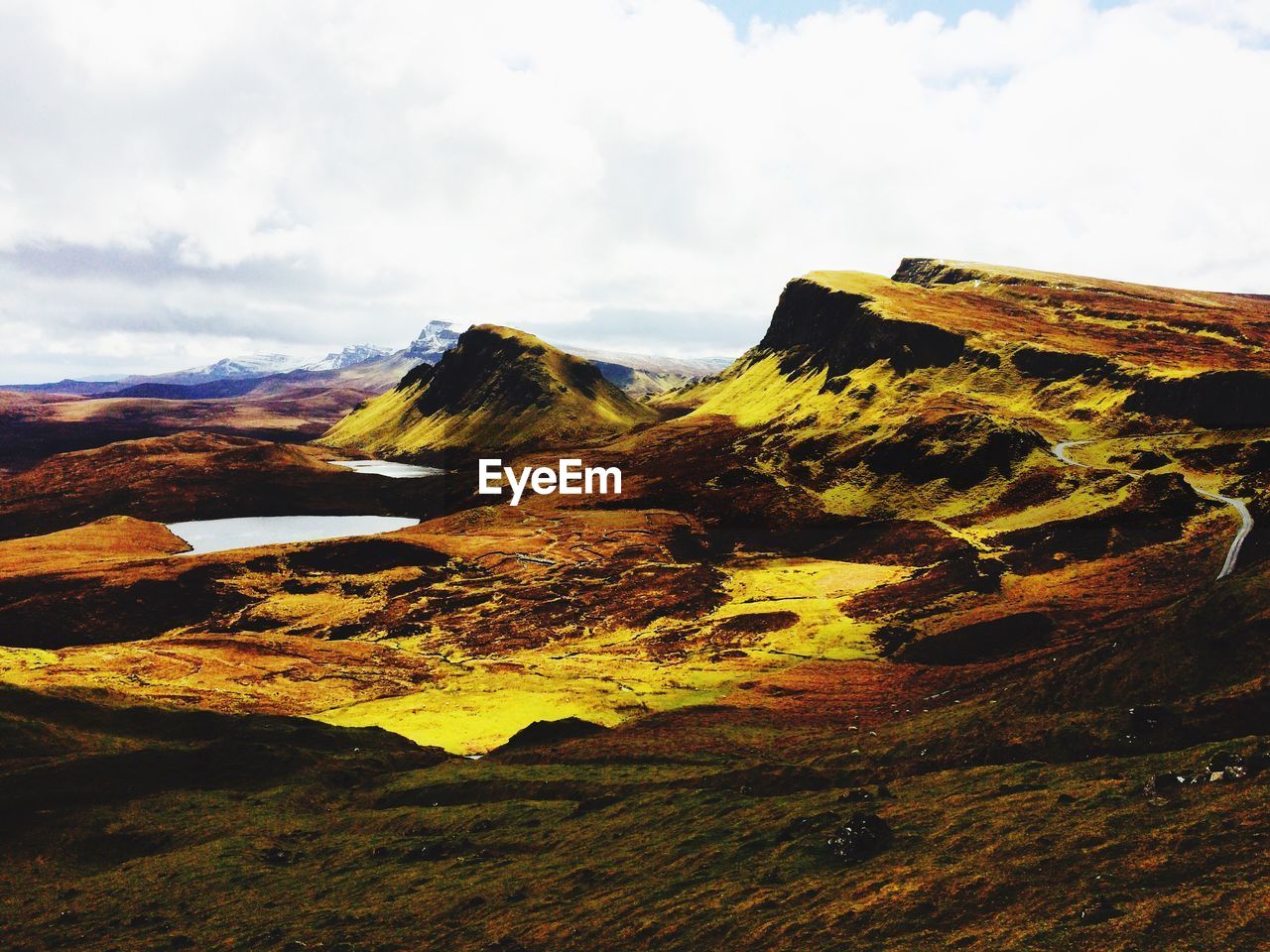 Scenic view of landscape against cloudy sky