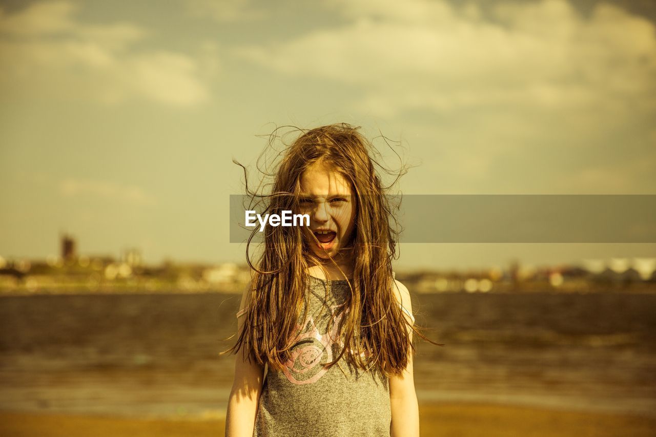 Portrait of cheerful girl screaming