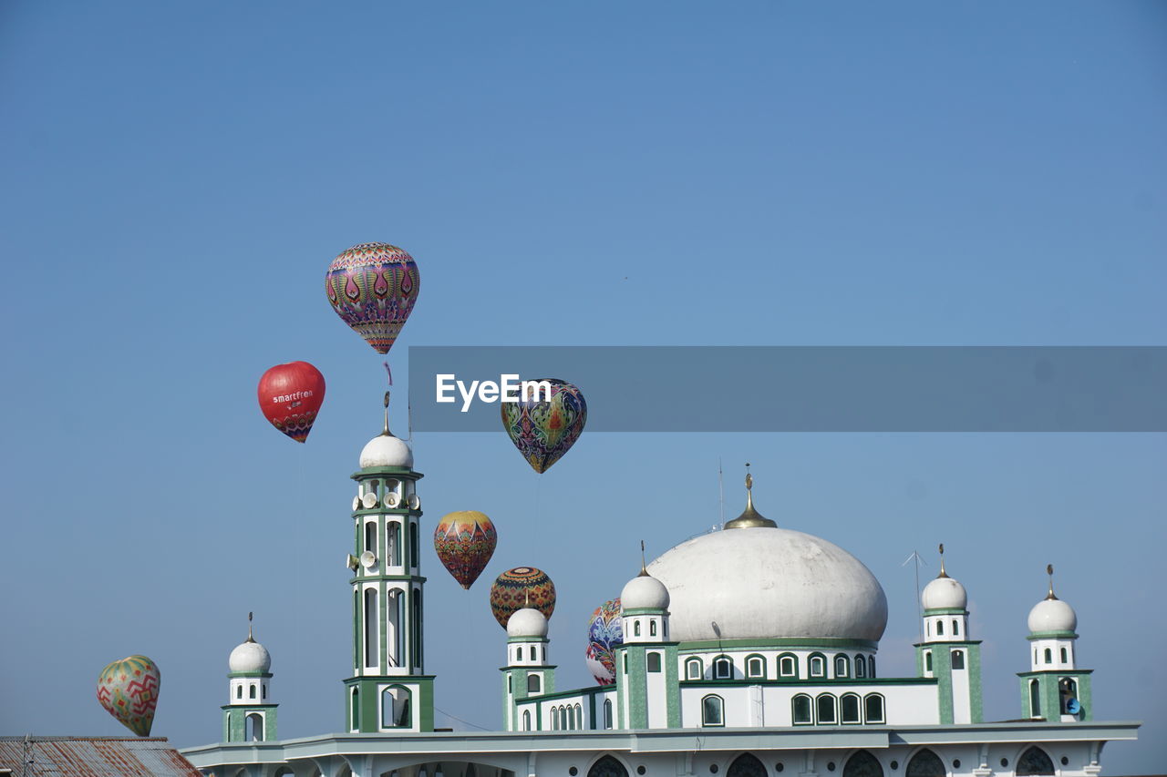 architecture, sky, built structure, clear sky, building exterior, dome, blue, nature, travel destinations, vehicle, travel, no people, religion, city, day, tourism, place of worship, building, belief, transportation, outdoors, sunny, balloon