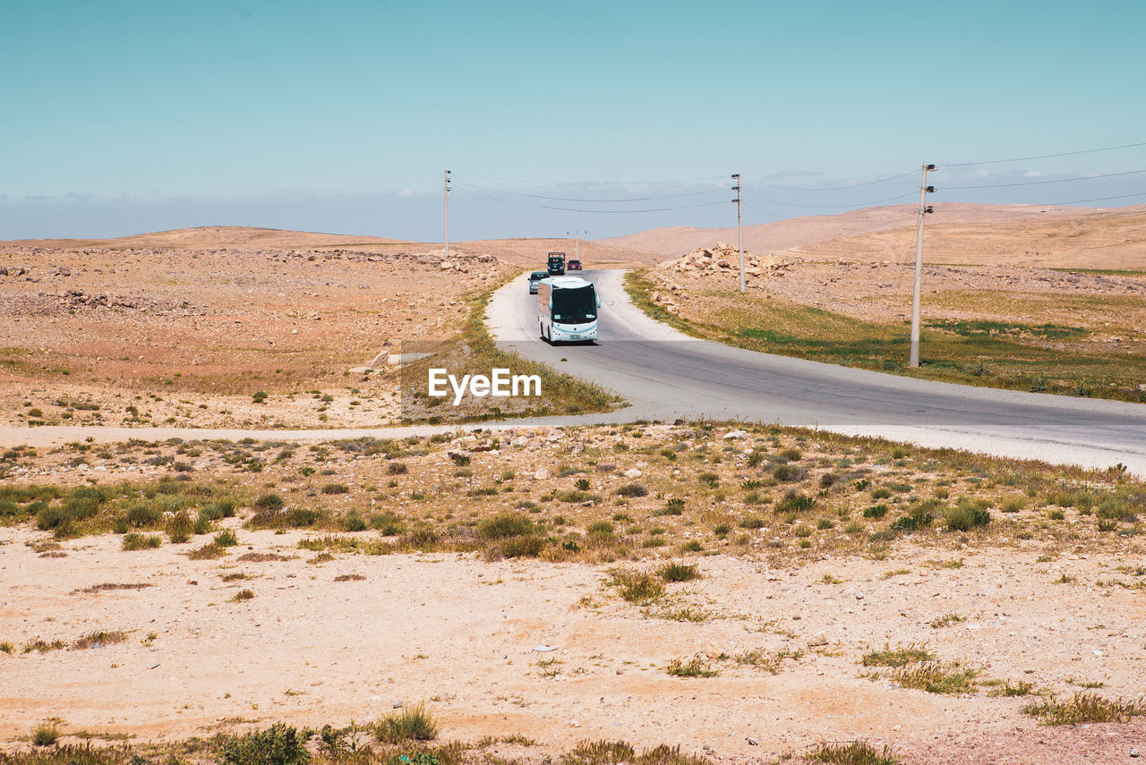 CAR MOVING ON ROAD ALONG SIDE