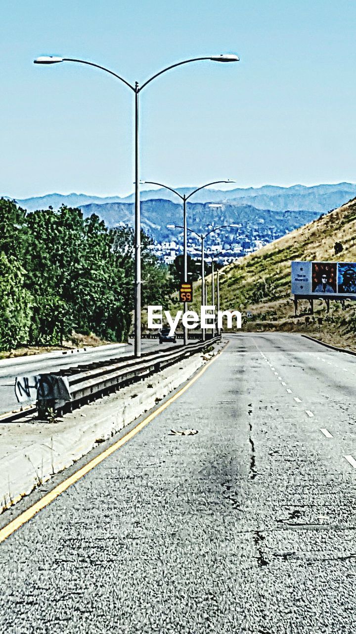 EMPTY ROAD ALONG BUILDINGS