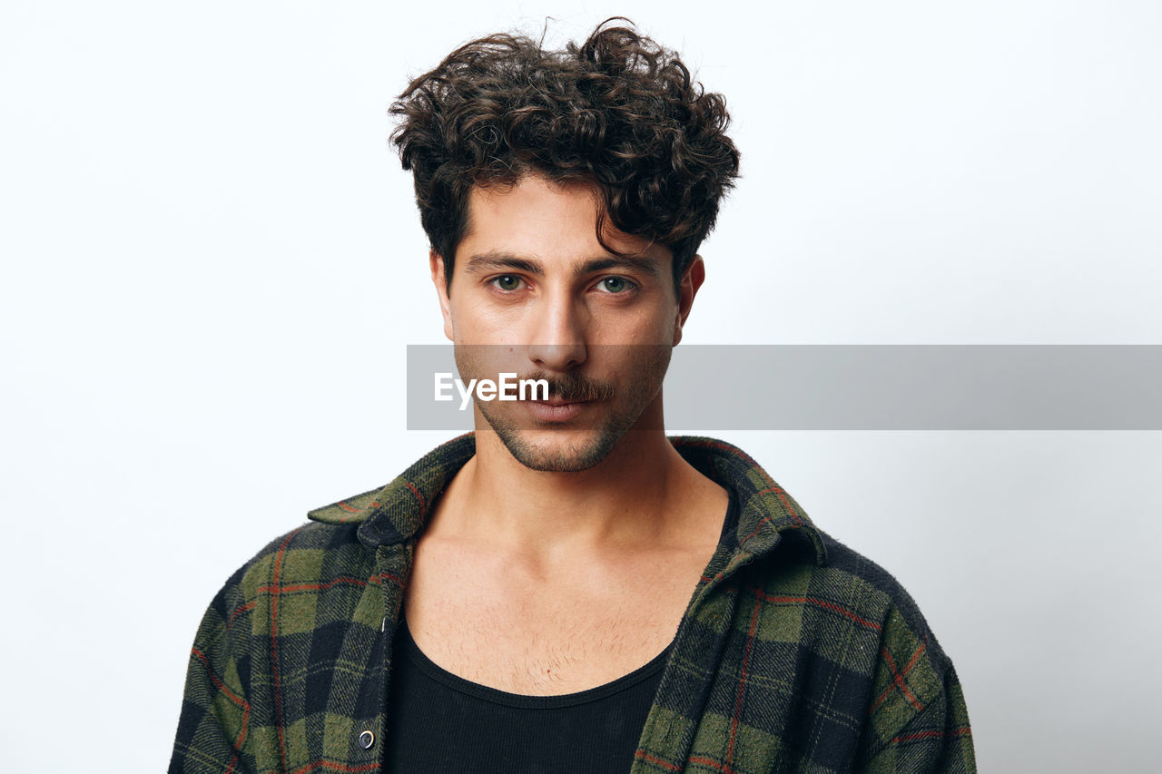 portrait of young man against clear sky