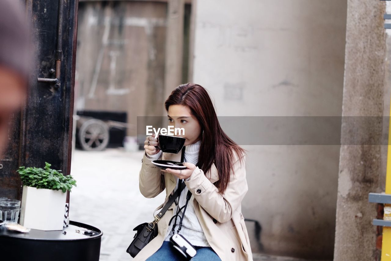 Young woman having coffee