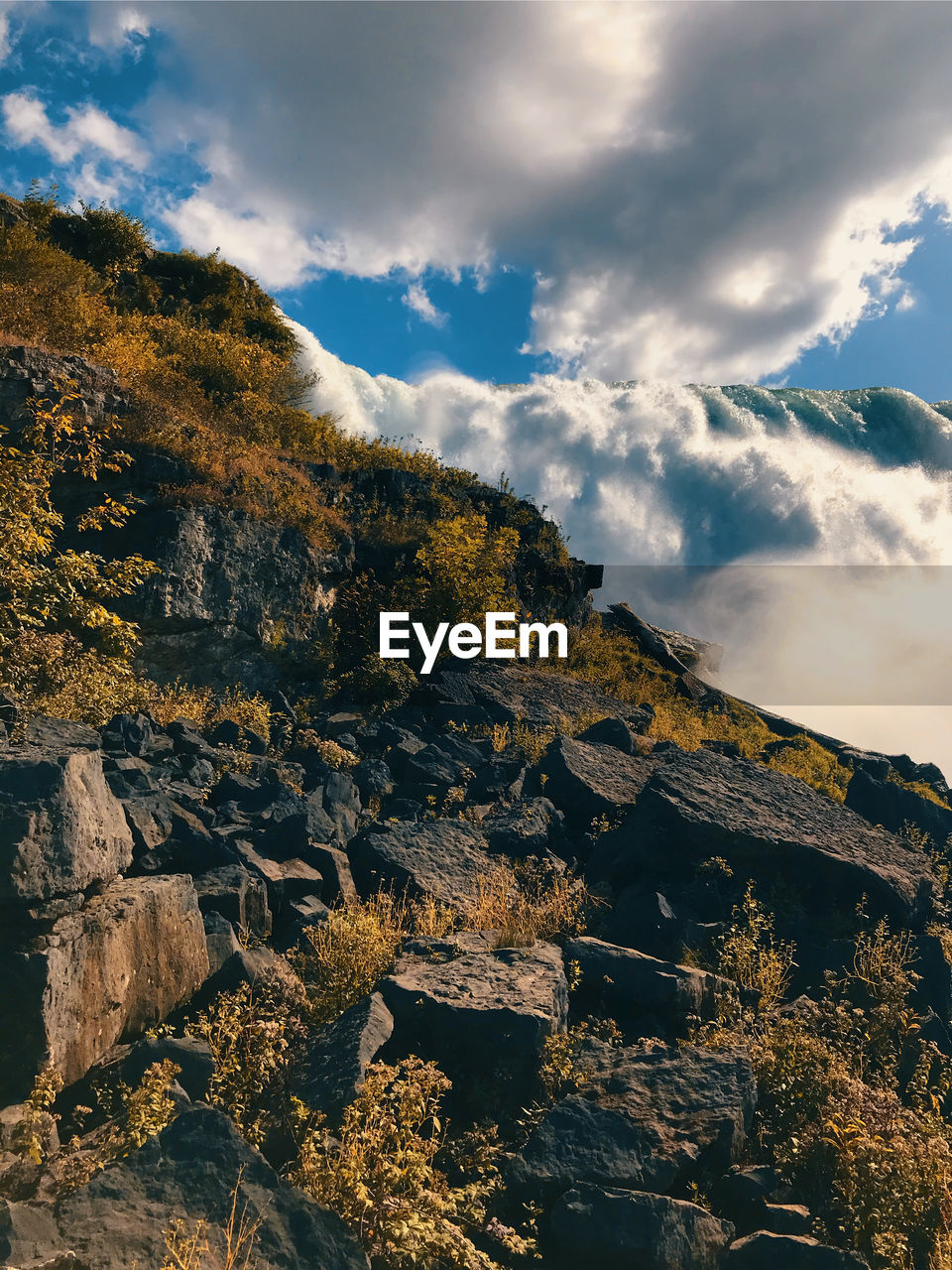 Low angle view of rocks against sky