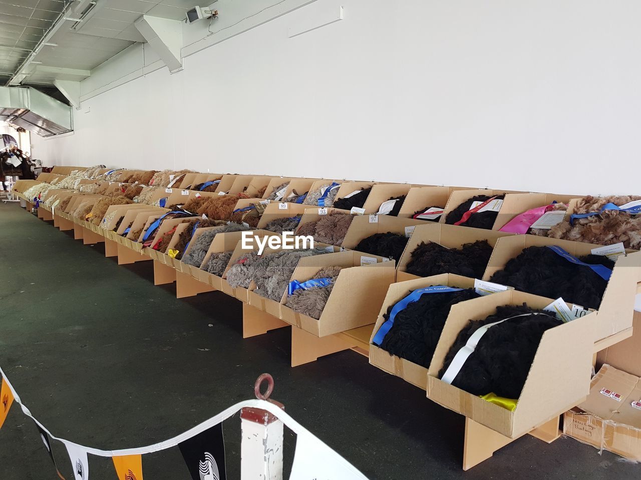 AERIAL VIEW OF MULTI COLORED CHAIRS IN STADIUM