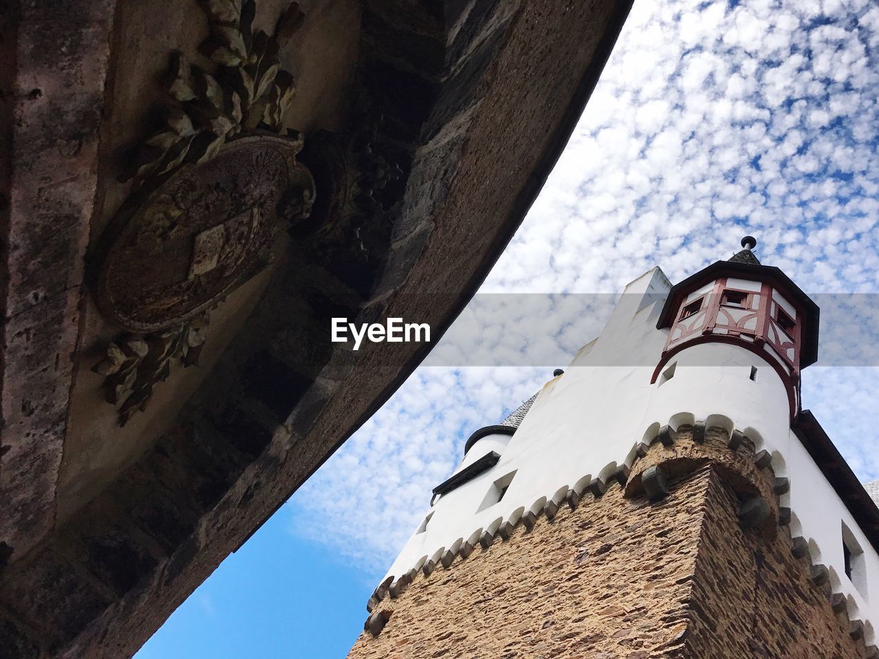 Low angle view of bell tower against sky