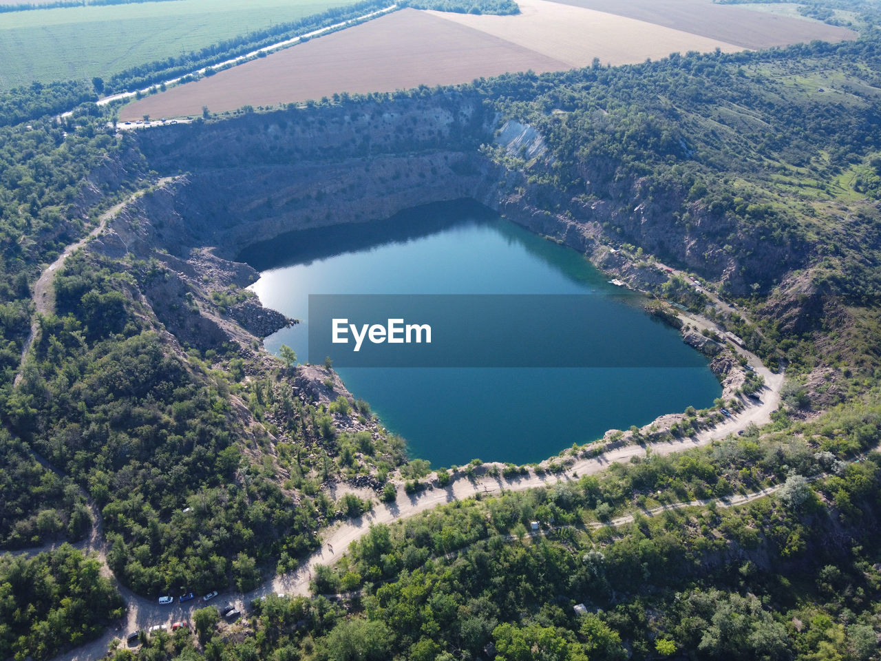 HIGH ANGLE VIEW OF LAKE AND TREES