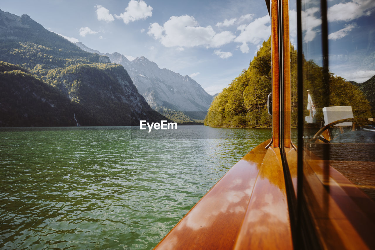 SCENIC VIEW OF LAKE AGAINST MOUNTAIN RANGE