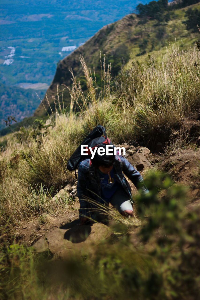 High angle view of man climbing outdoors