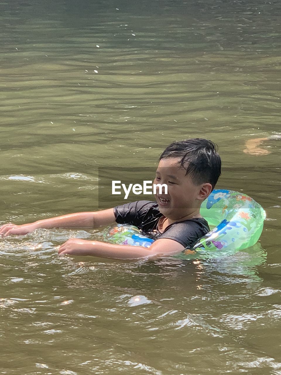 FULL LENGTH OF SHIRTLESS BOY IN WATER