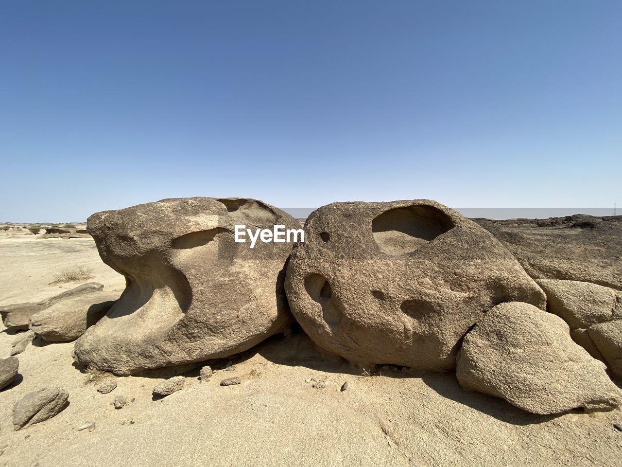 ROCKS ON ROCK AGAINST SKY