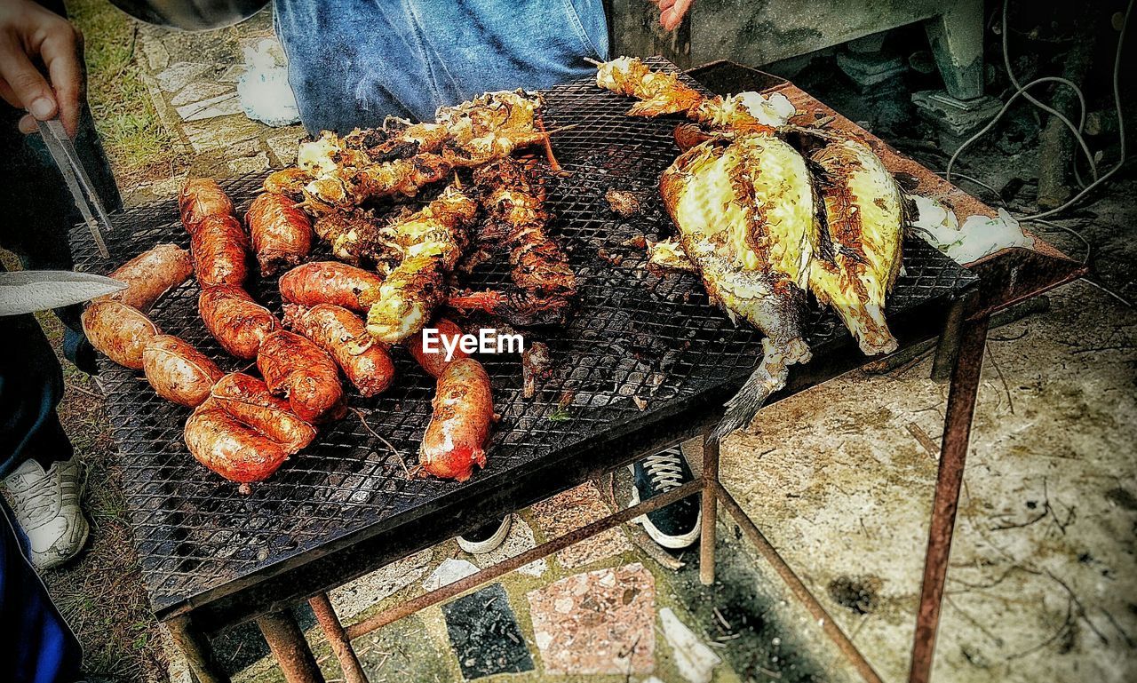 High angle view of grilled foods on barbeque