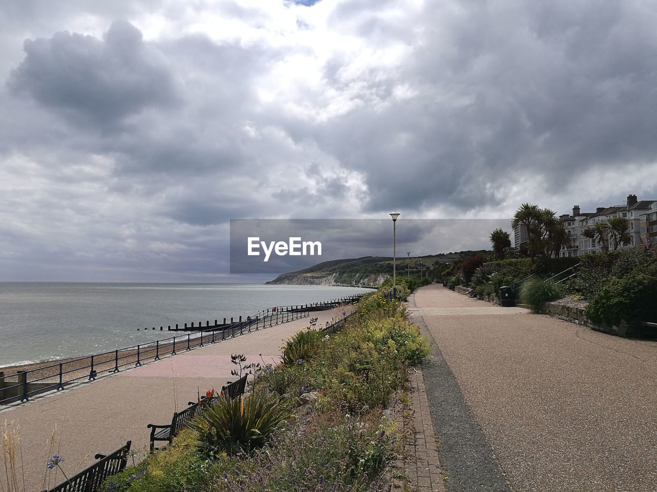 PANORAMIC VIEW OF ROAD BY SEA AGAINST SKY