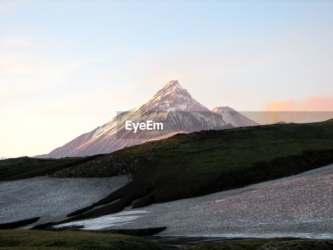 Scenic view of snowcapped mountains against clear sky