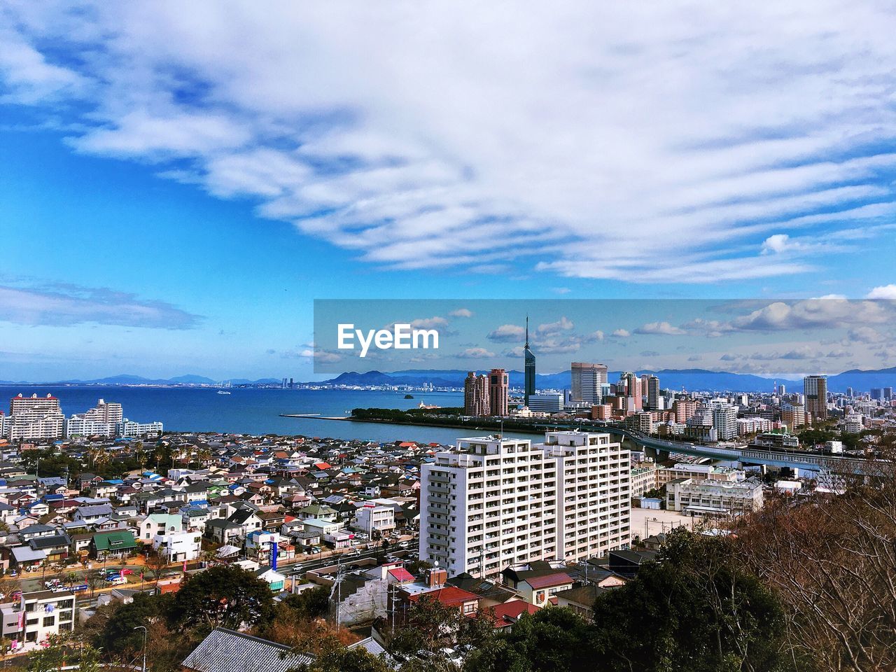 Cityscape with sea in background