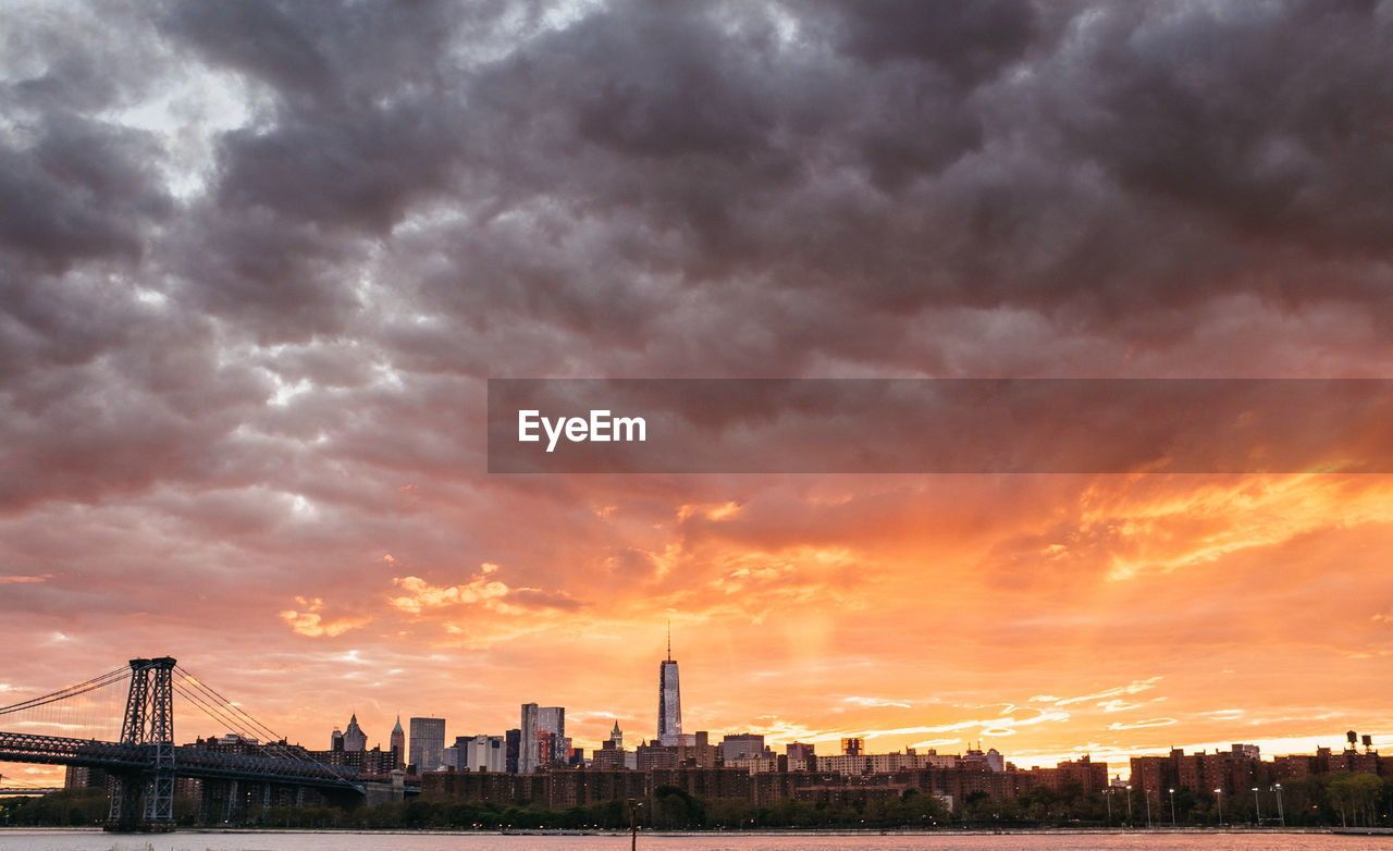 BUILDINGS AGAINST SKY DURING SUNSET