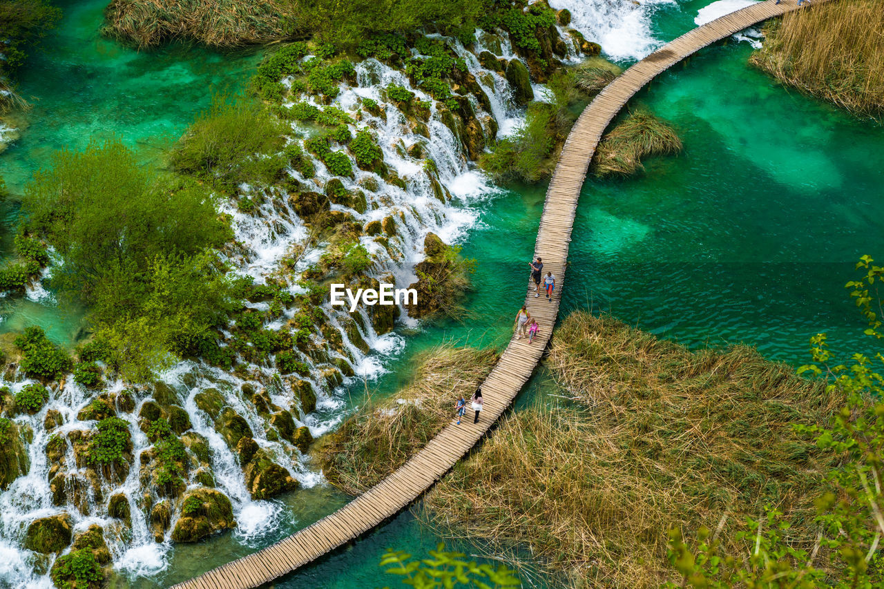 People on boardwalk at plitvice lakes national park