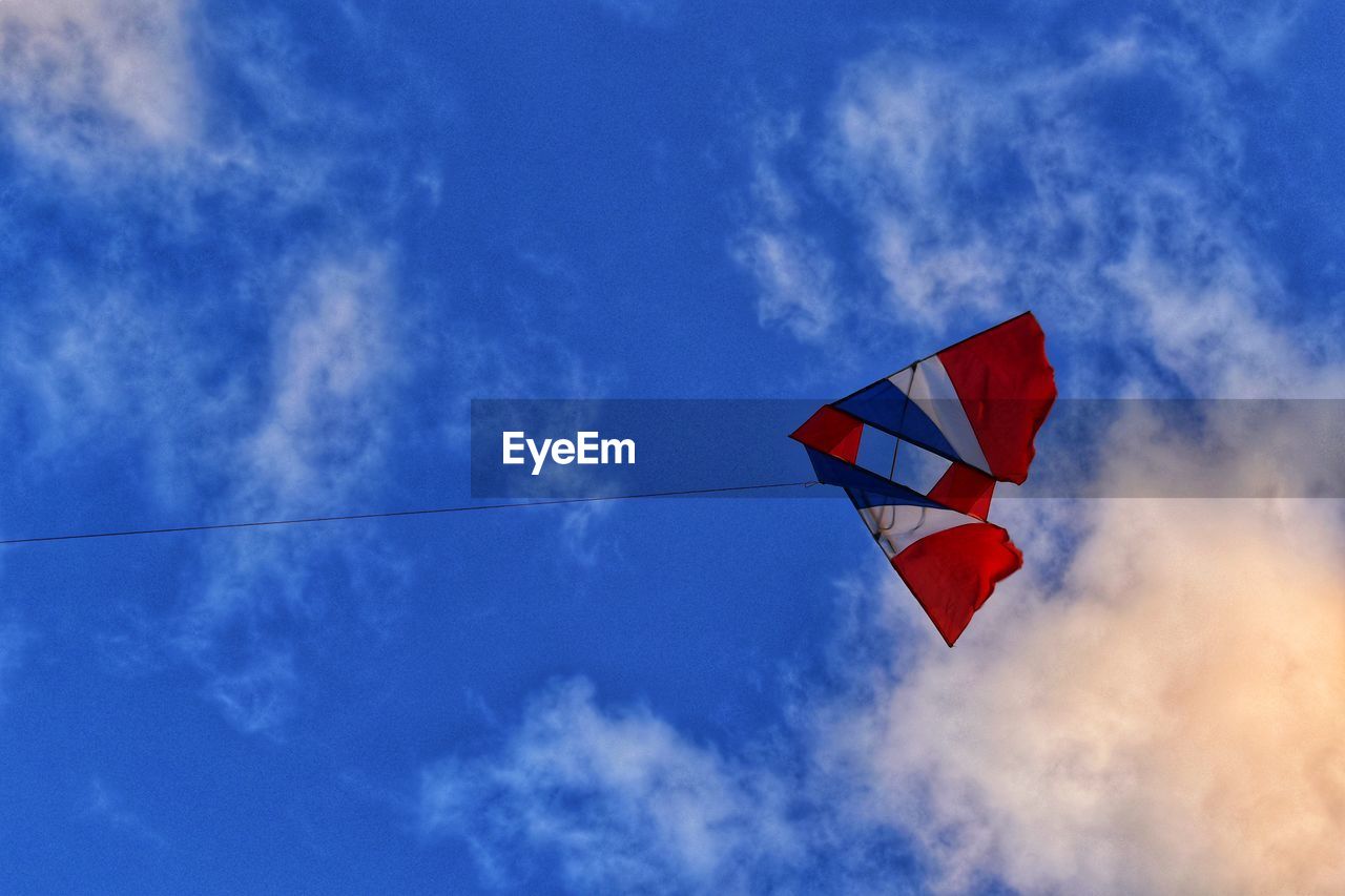 Low angle view of kite against sky