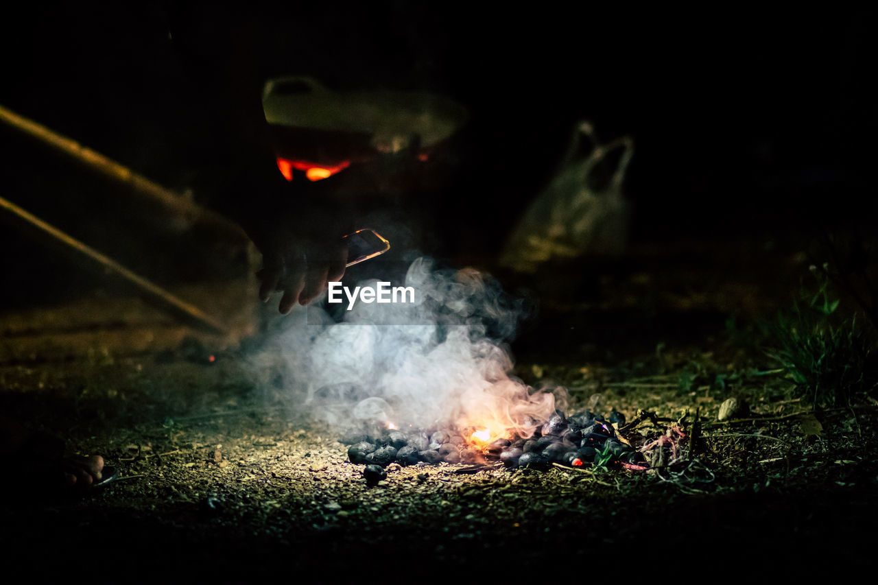 CLOSE-UP OF FIRE IN FIELD