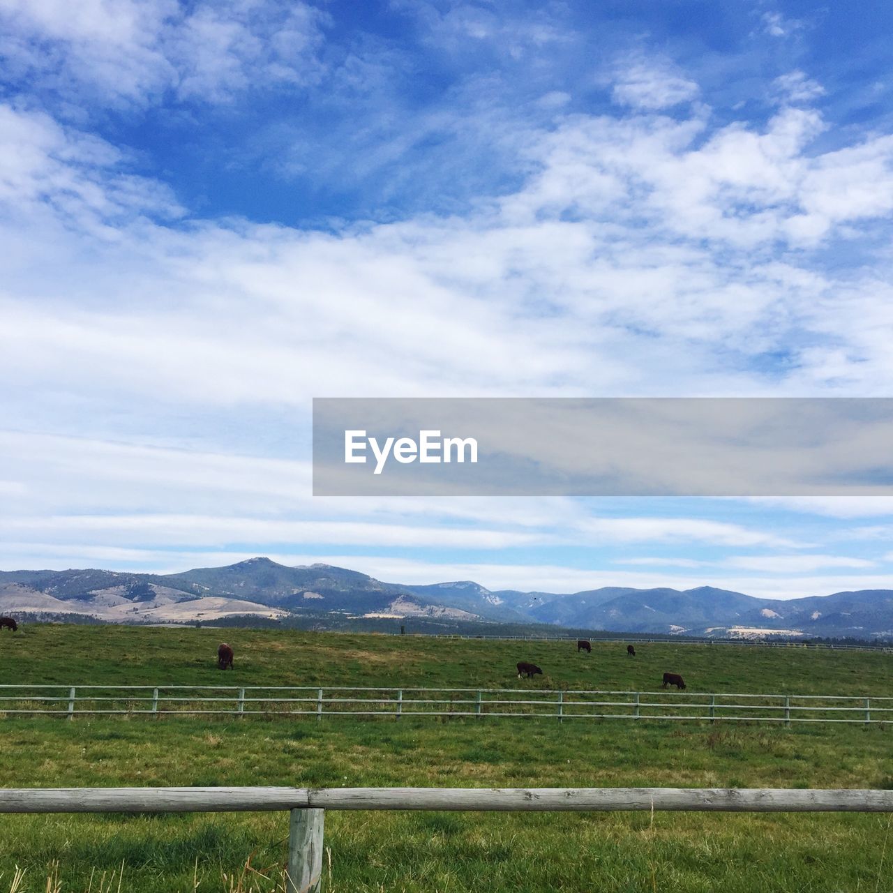 SCENIC VIEW OF MOUNTAINS AGAINST CLOUDY SKY