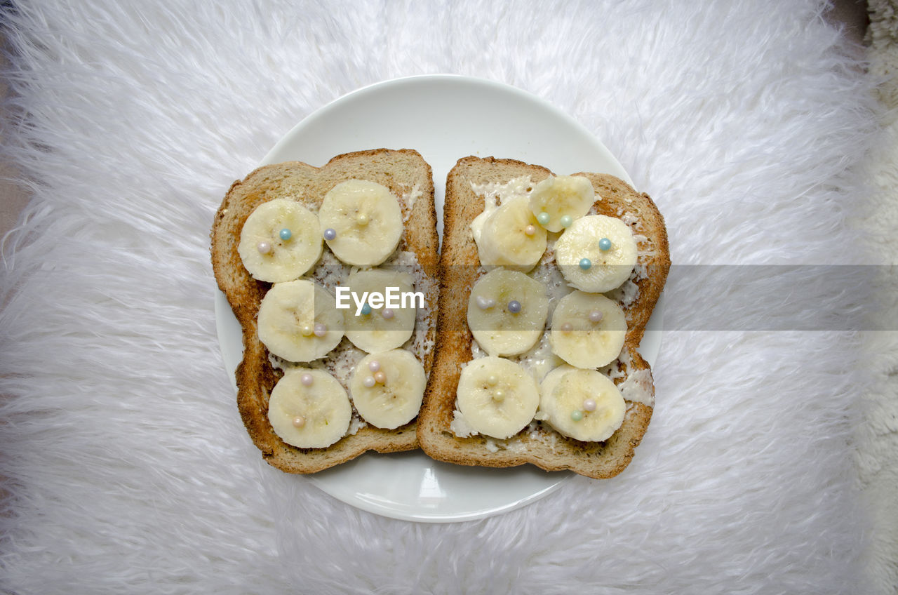 Directly above shot of food in plate on cushion