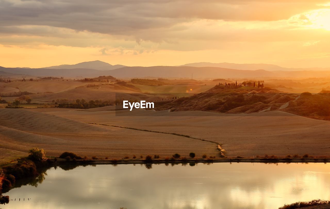 Scenic view of mountains against sky during sunset