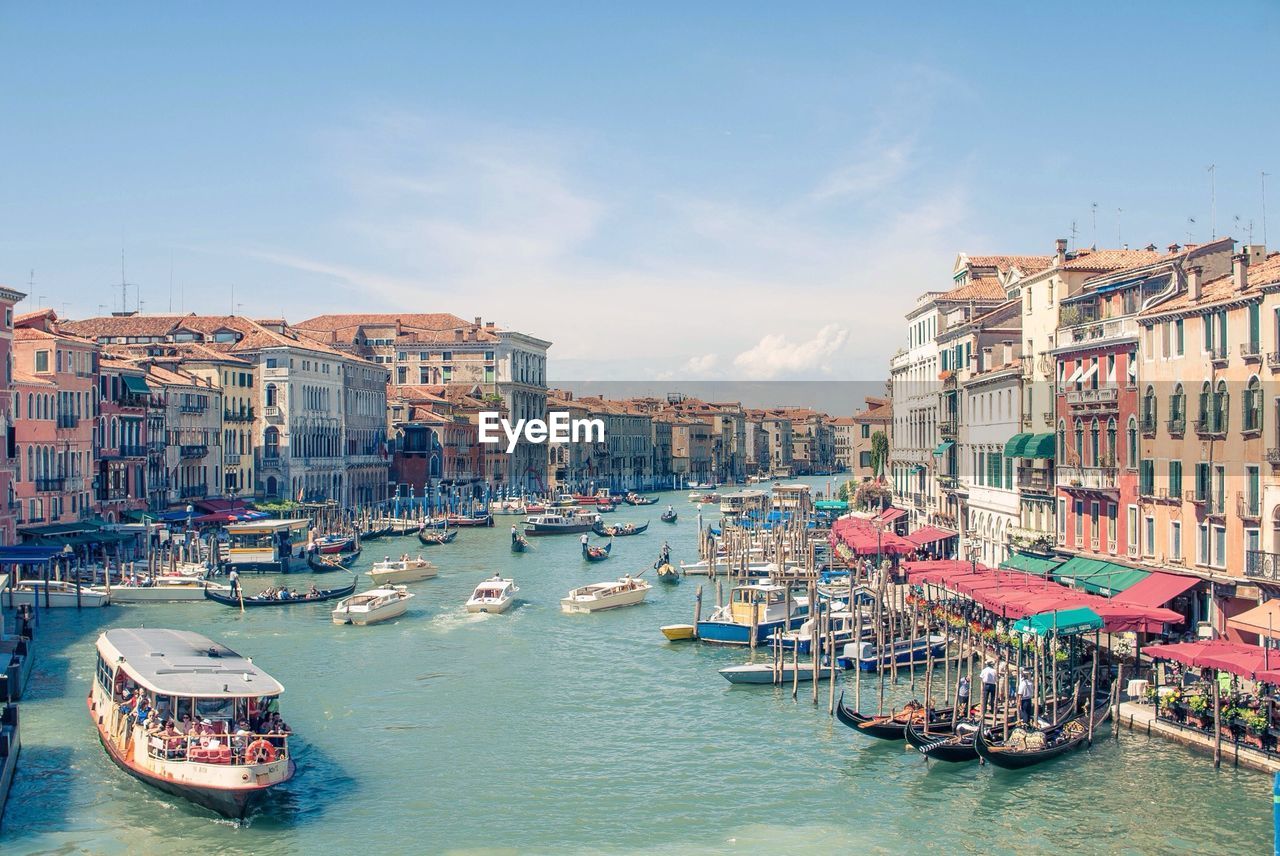 Boats in grand canal against sky