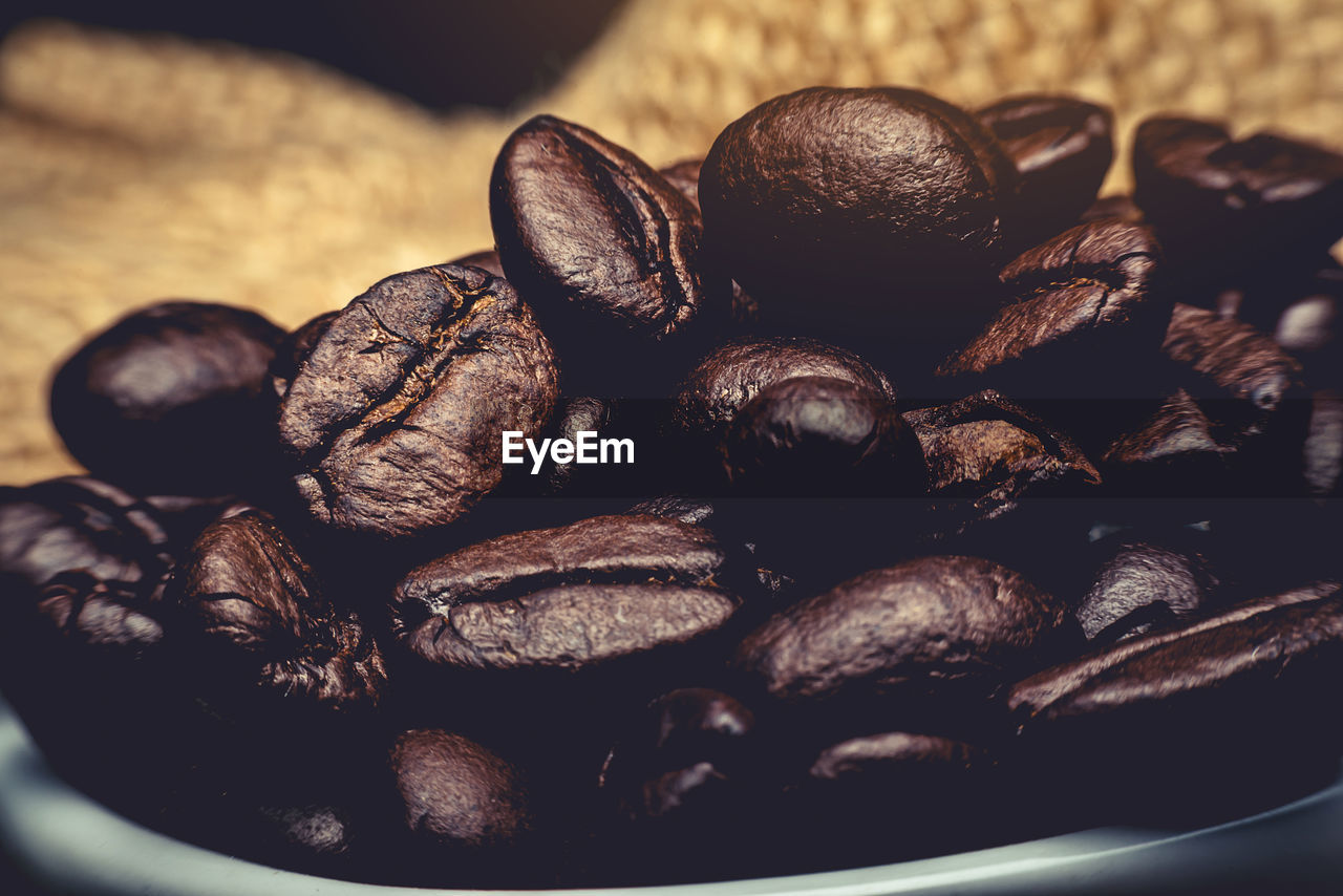 The raw coffee beans are preparing to grind into delicious coffee.