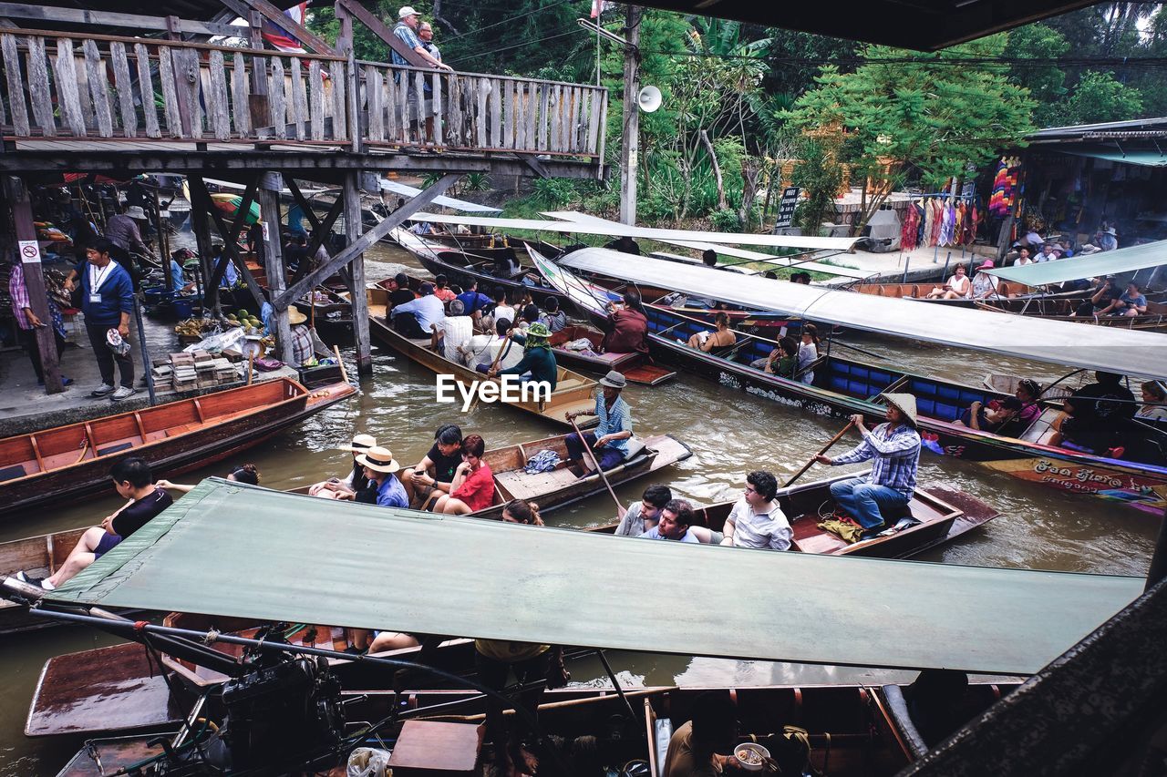 HIGH ANGLE VIEW OF PEOPLE IN BOAT