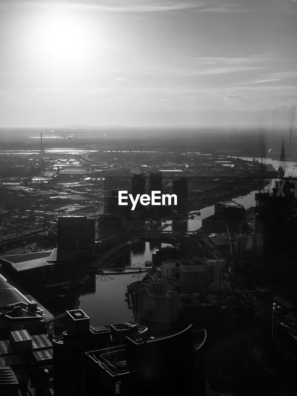 High angle view of river and cityscape against sky