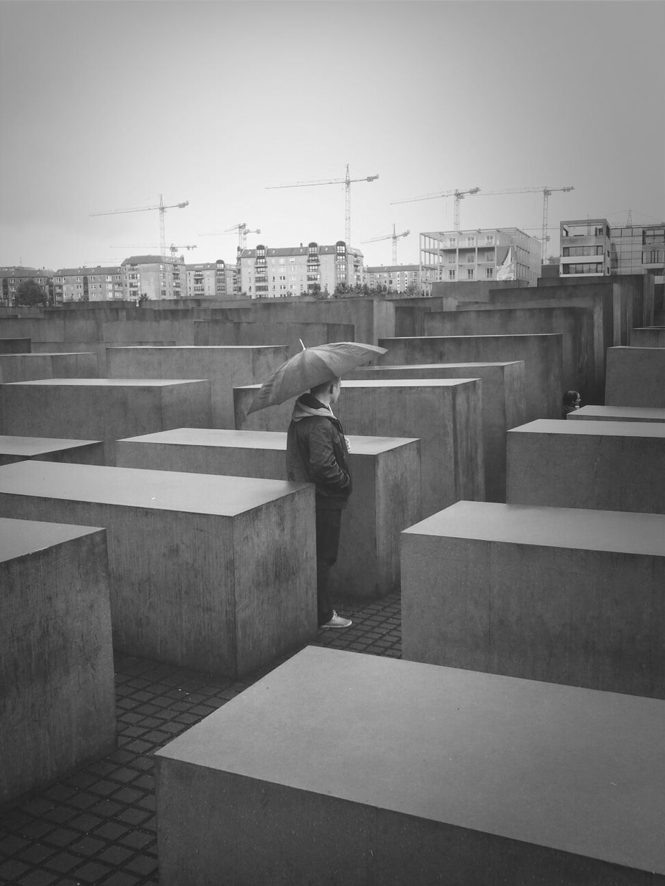 WOMAN STANDING IN CITY