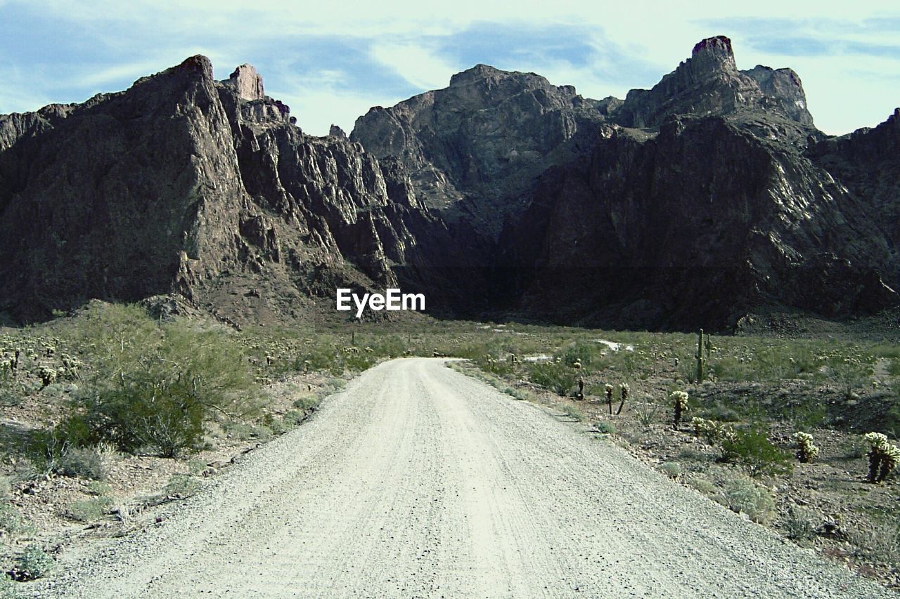 ROAD PASSING THROUGH MOUNTAINS