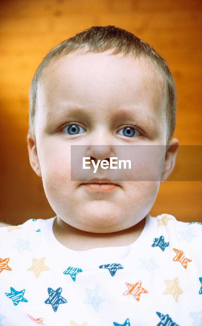 CLOSE-UP PORTRAIT OF CUTE BOY WITH BABY