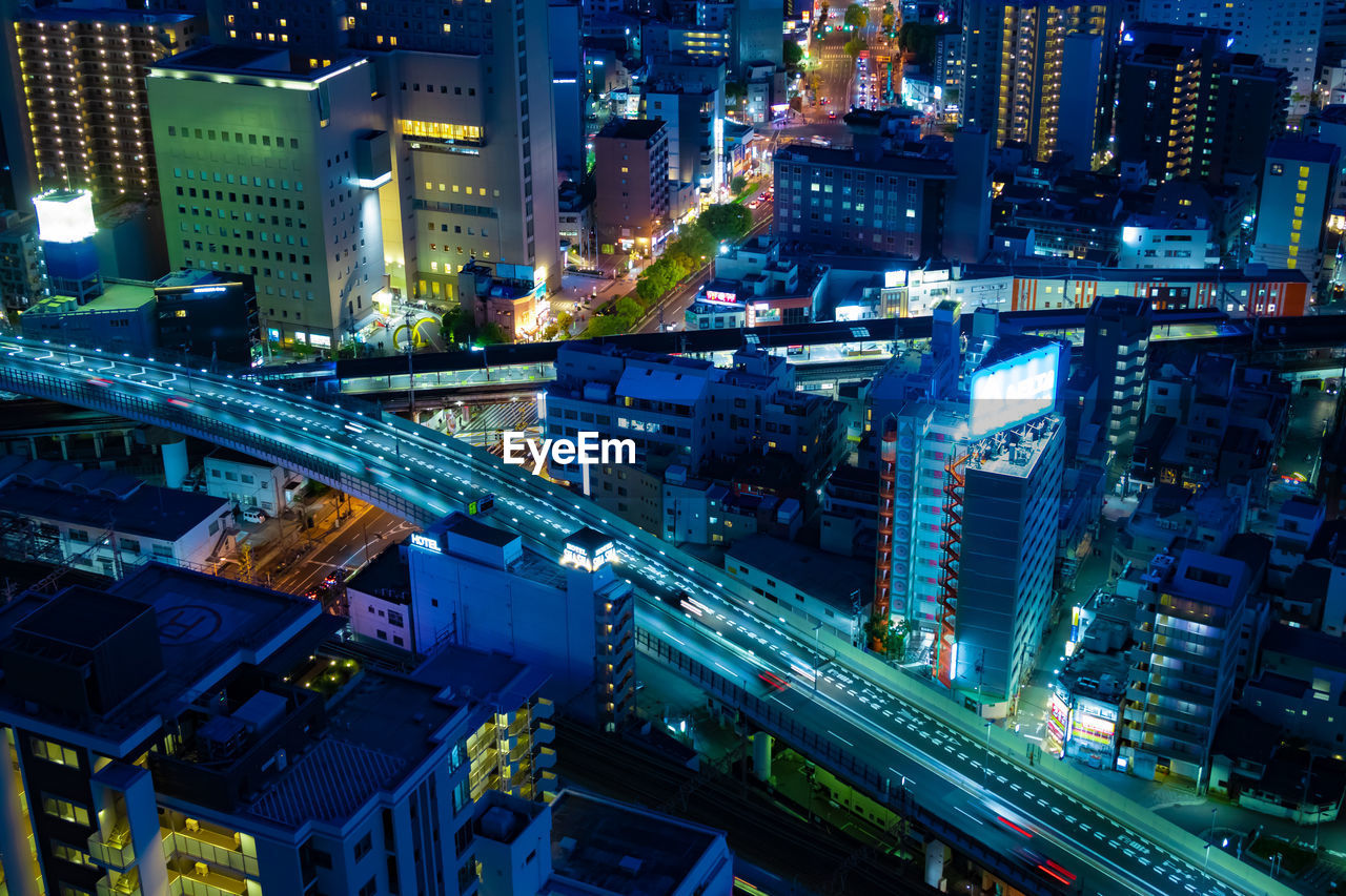 high angle view of illuminated city street at night