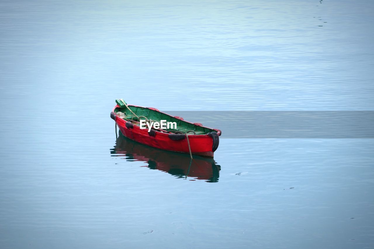 Boat moored in lake