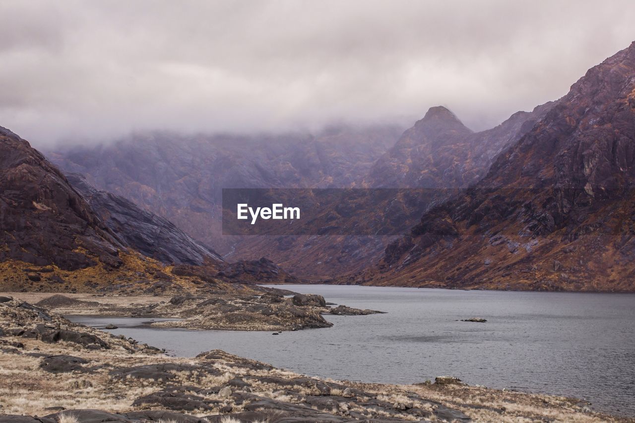 Scenic view of mountains against dramatic sky