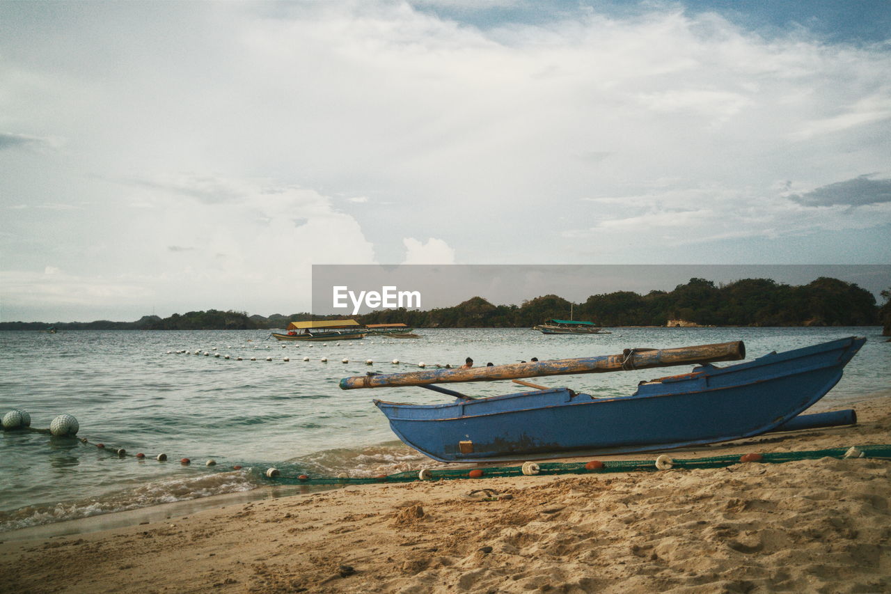 View of calm beach against the sky
