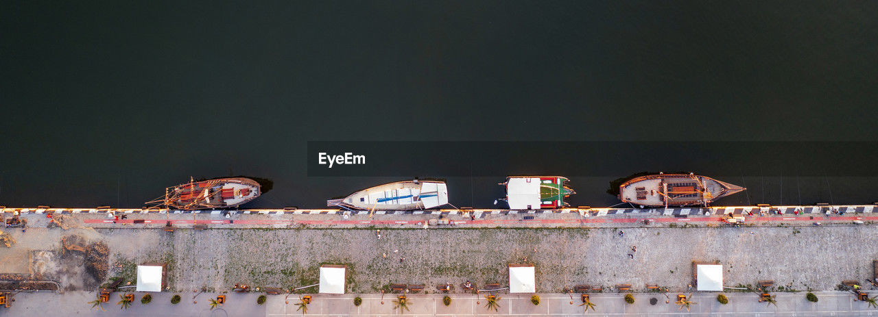 Panoramic view by drone of yachts or small boats moored at the quay. parking