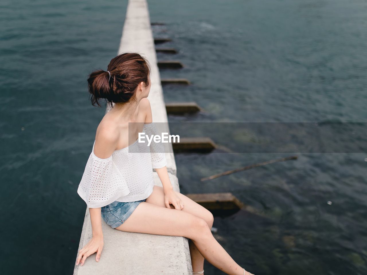 YOUNG WOMAN IN SEA