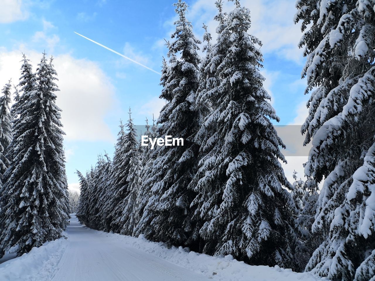 SNOW COVERED LAND AGAINST SKY