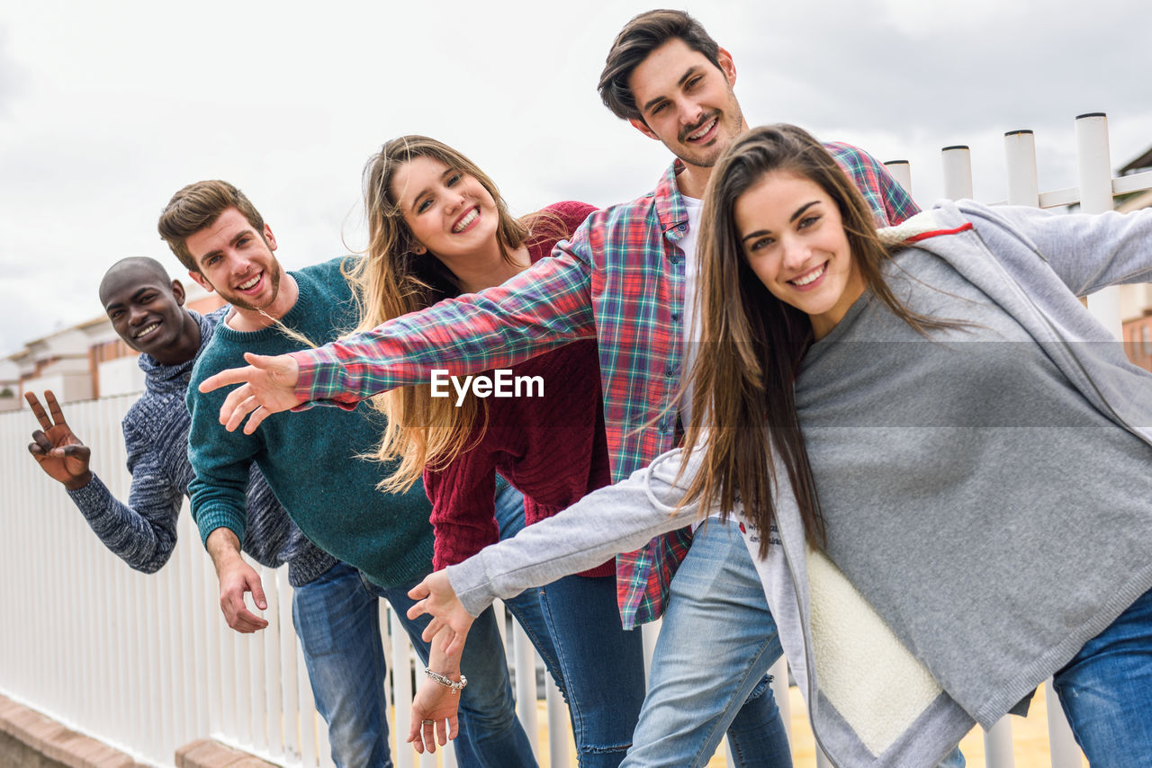 Portrait of smiling friends enjoying outdoor