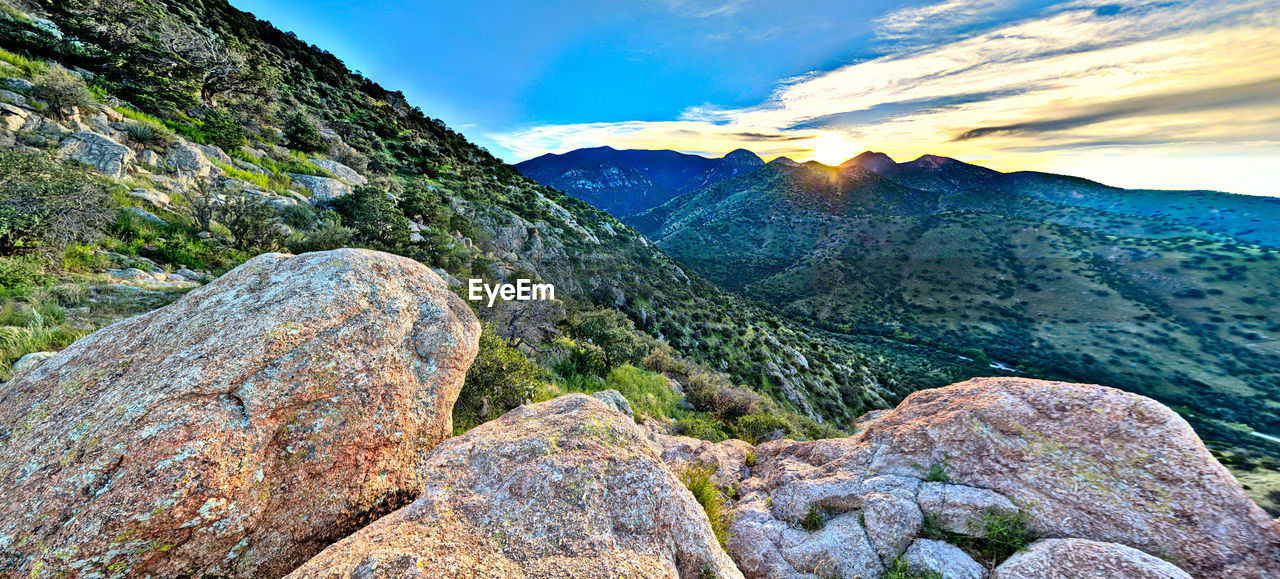 Rock formations on landscape against sky