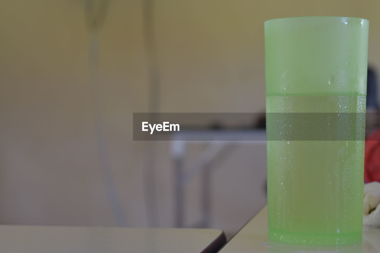 CLOSE-UP OF DRINK IN GLASS