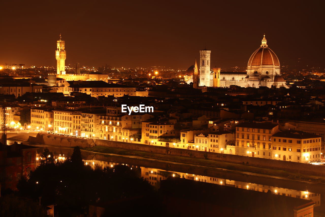 Illuminated buildings in city at night