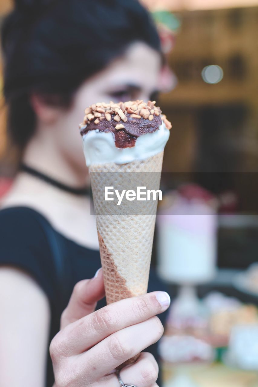 Close-up of woman holding ice cream