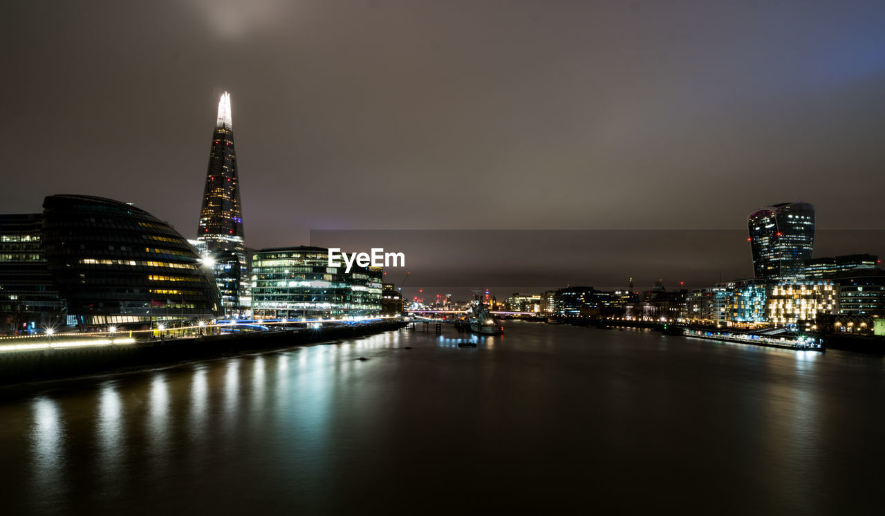 ILLUMINATED BUILDINGS AT WATERFRONT