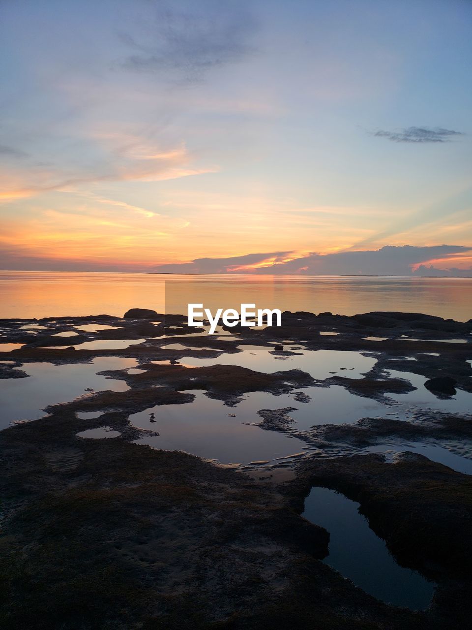 Scenic view of sea against sky during sunset