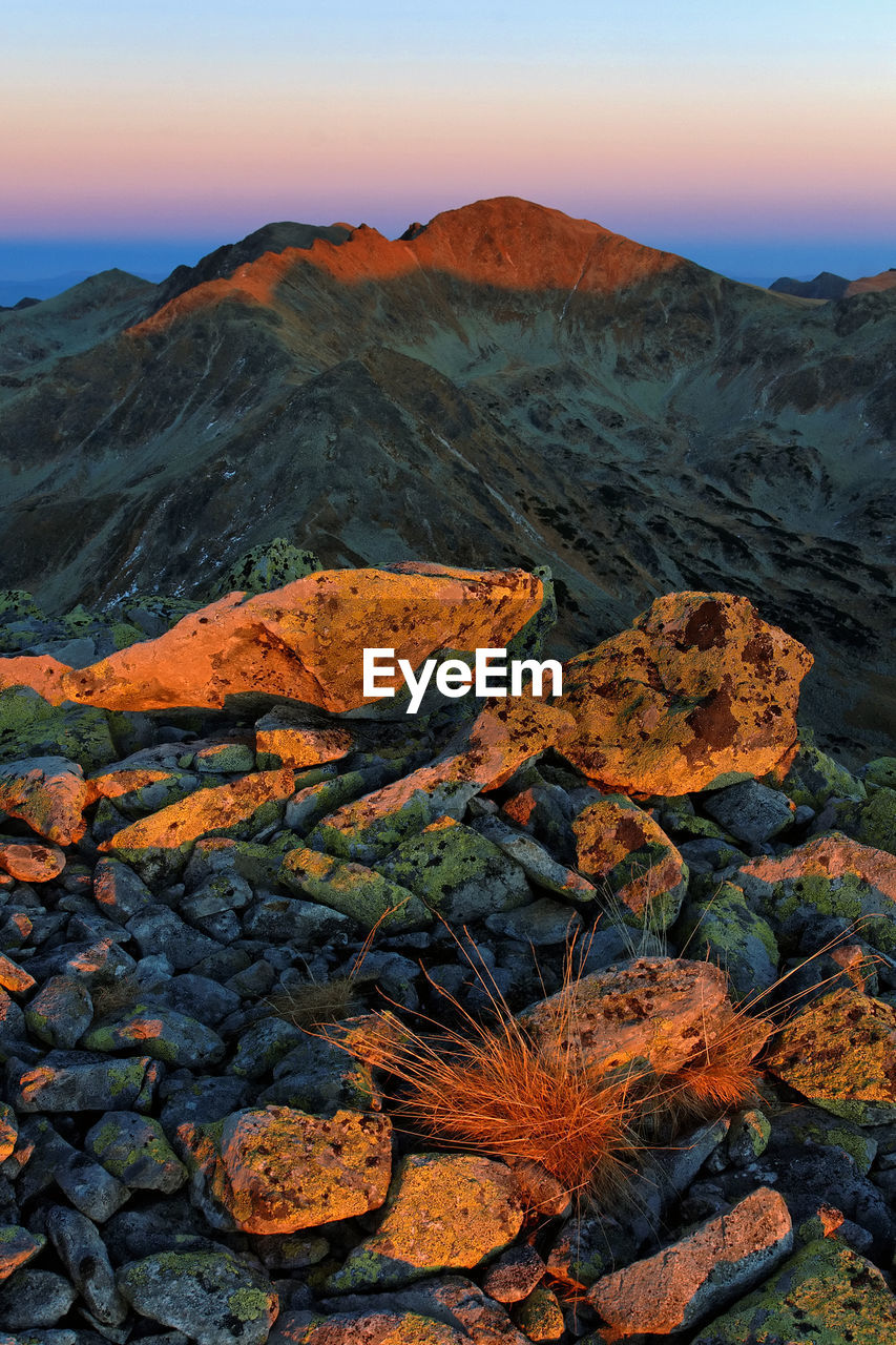 Scenic view of mountains against sky during sunset