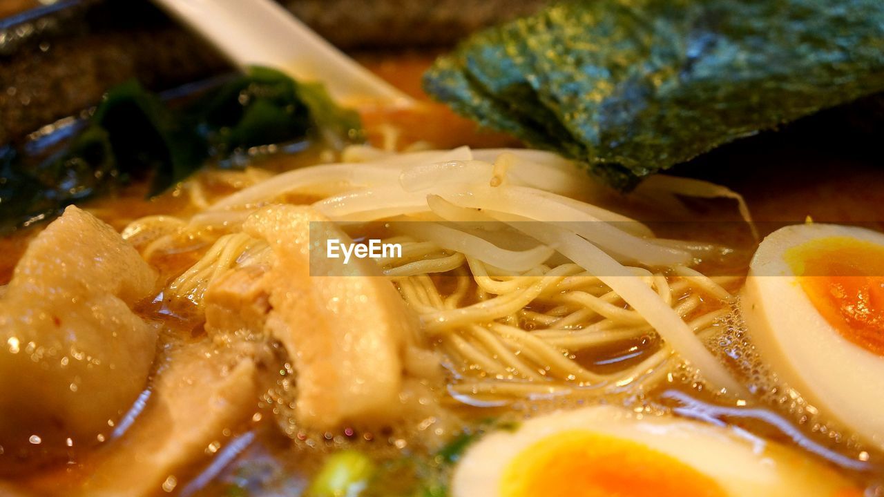 Close-up of noodles and egg in bowl